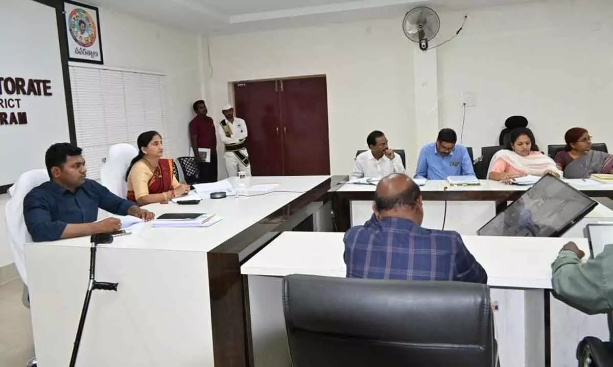 District Collector K Madhavi Latha, Joint Collector Ch Sridhar and other officials participating in a videoconference with CM YS Jagan Mohan Reddy, from Rajamahendravaram on Thursday