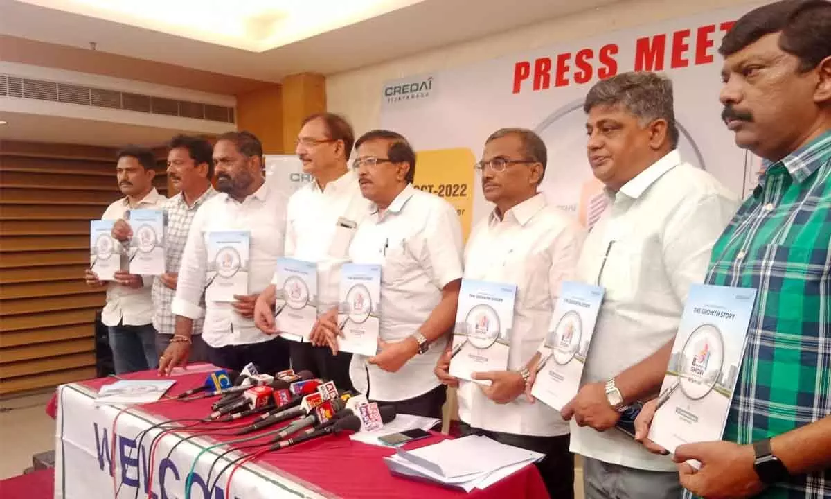 CREDAI Vijayawada Chapter president K Rajendra along with members releasing brochure of the property show, in Vijayawada