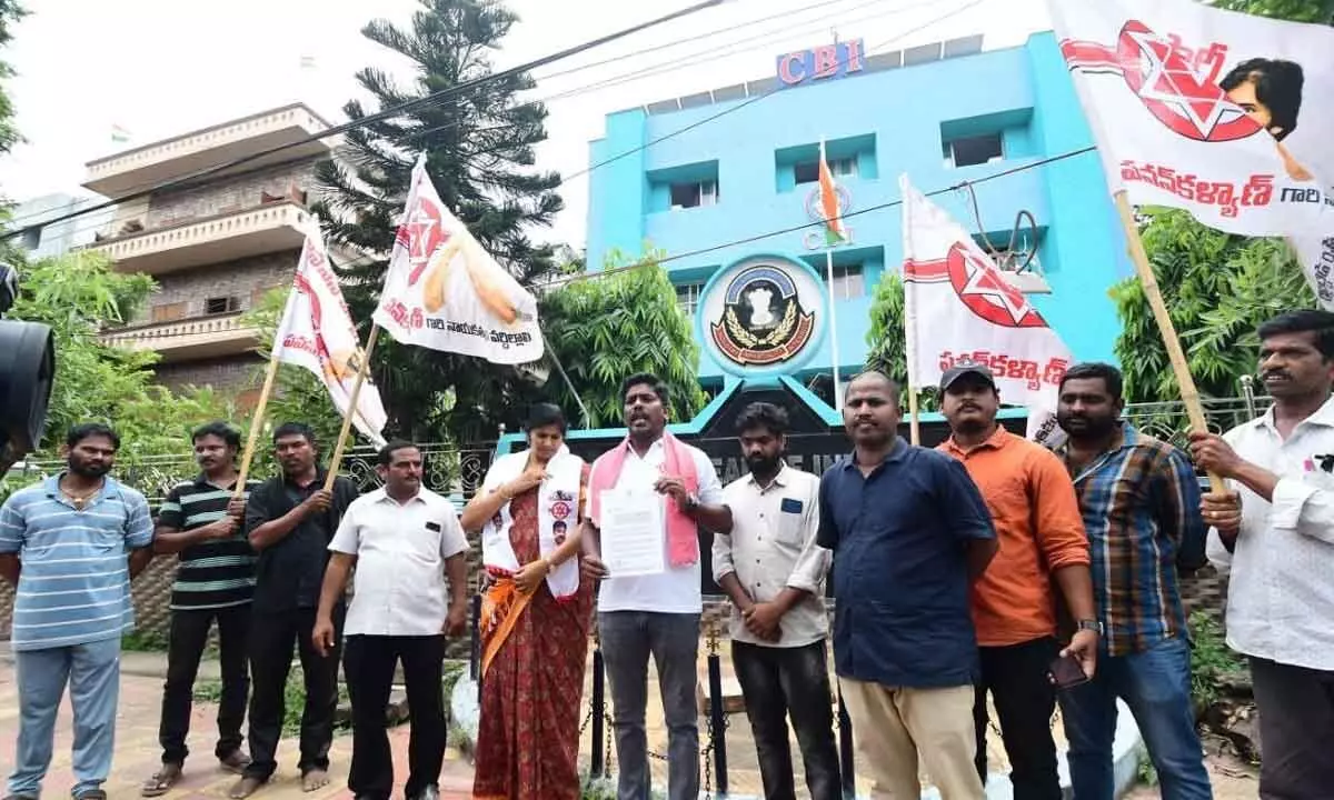 Jana Sena Party corporator P Murthy Yadav displaying a complaint copy in Visakhapatnam on Friday.