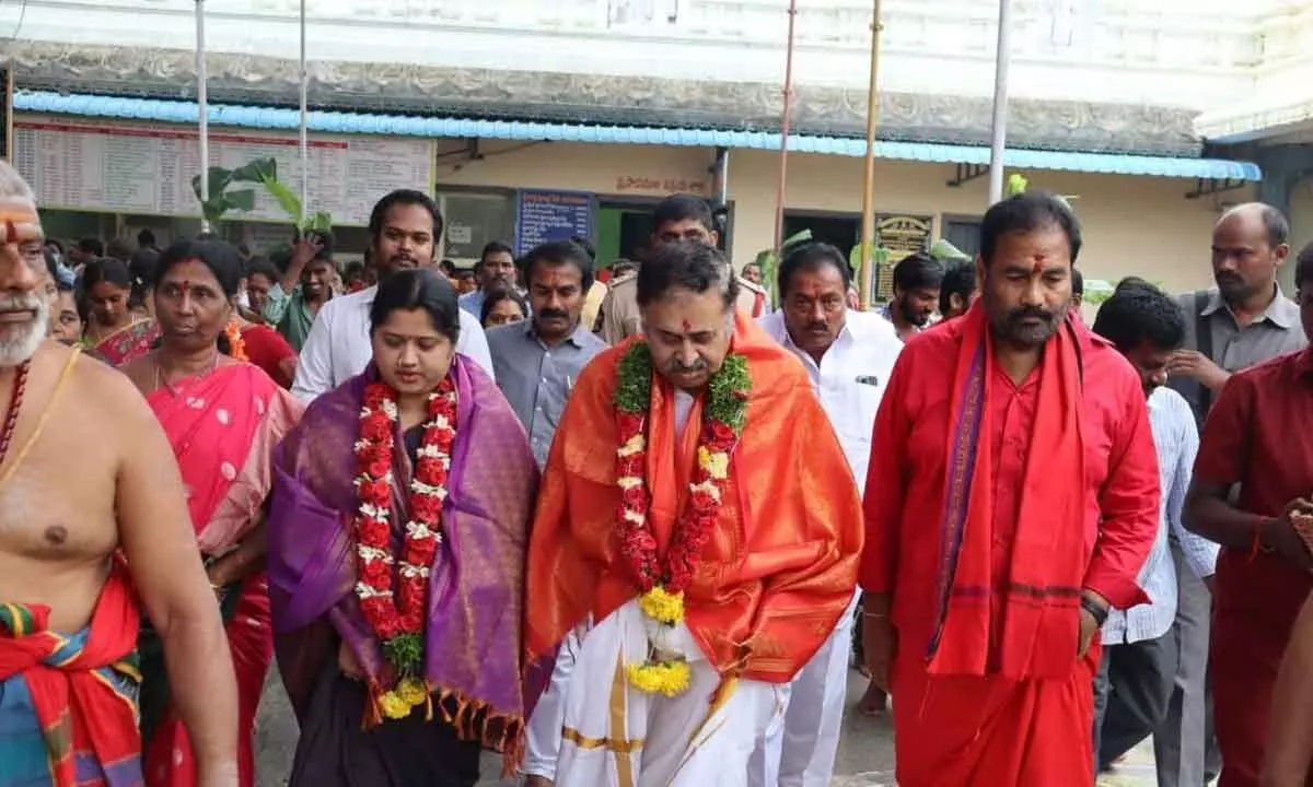 TTD Board member Krisnamurthy Vaithiyanathan and his wife Anuradha arriving to take part in the Abhisheka Seva of Lord Mallikarjuna Swamy and Sahasranamarchana Seva of Goddess Kamakshitayee in Jonnawada temple on Friday. Temple Chairman Putta Lakshmi Subrahmanyam Naidu and EO D Venkateswarlu, Nellore Rural MLA  Kotamreddy Sridhar Reddy, RDO A Malola are also seen.