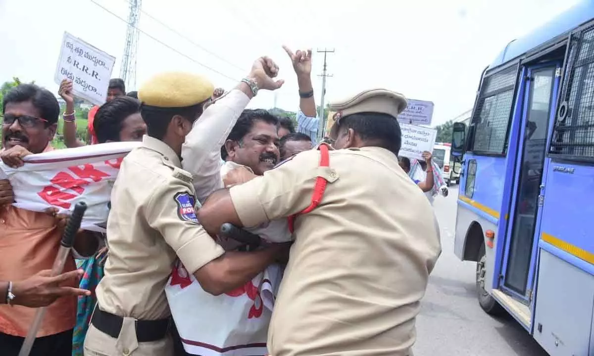 Police arresting Regional Ring Road victims during their protest at Rayagiri on Friday