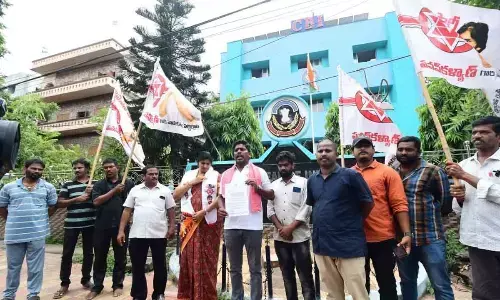 Jana Sena Party corporator P Murthy Yadav displaying a complaint copy in Visakhapatnam on Friday.