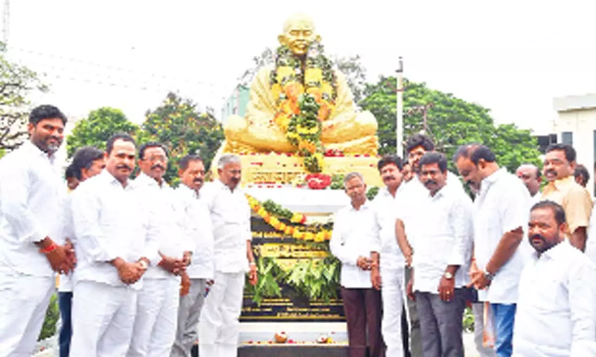 Ministers  P Ramachandra Reddy, K Narayana Swamy and others paying tributes at Mahatma Gandhi’s statue in Tirupati  on Sunday