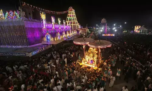 A magnificent view of Malayappa mounted on golden Garuda going in a procession in Tirumala on Saturday