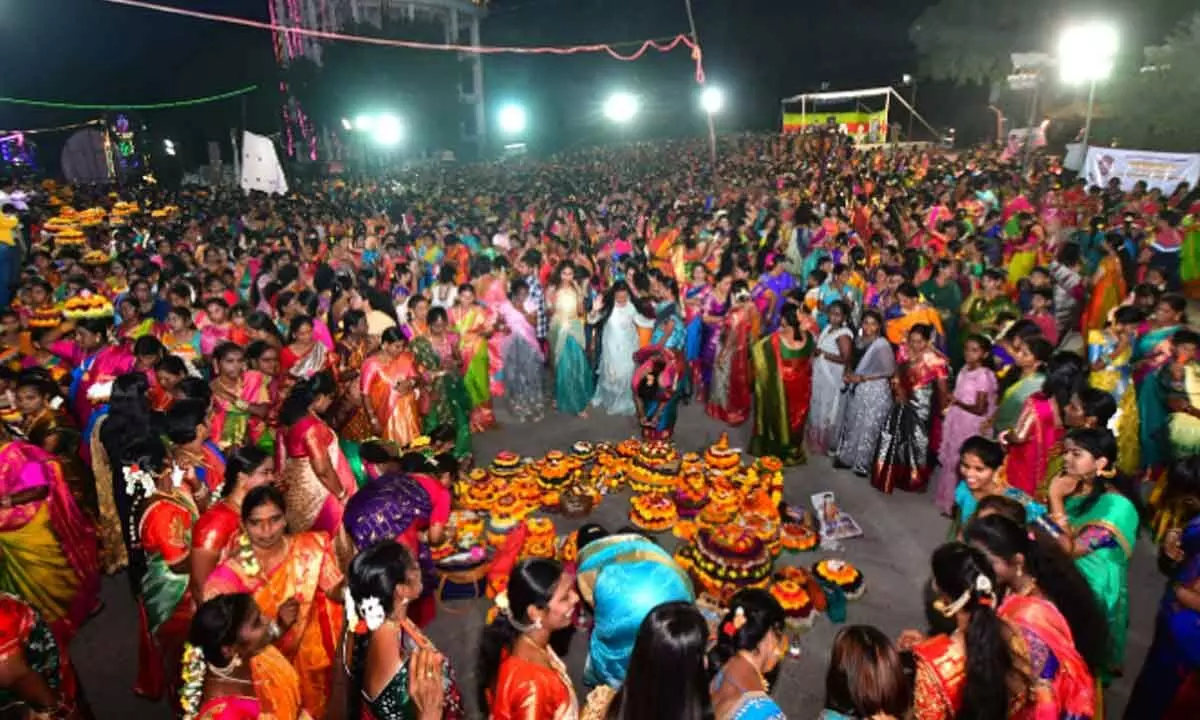 Women participating in Bathukamma celebrations in Karimnagar on Monday