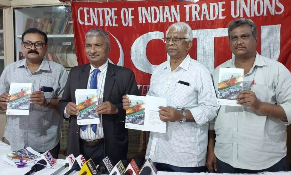 Centurion University Vice Chancellor GSN Raju and CITU state president Ch Narasinga Rao releasing a book in Visakhapatnam on Tuesday