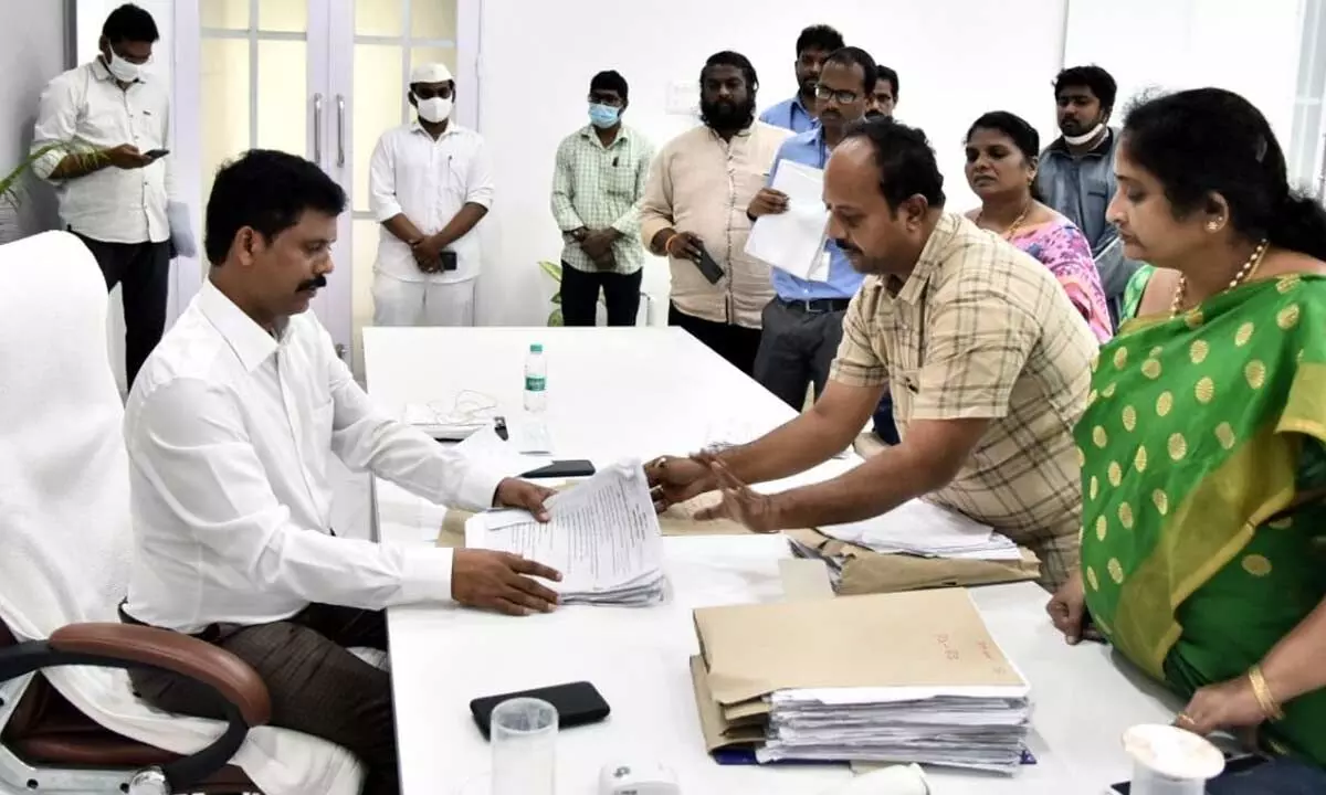 District Collector S Dilli Rao examining voters data in Vijayawada on Thursday