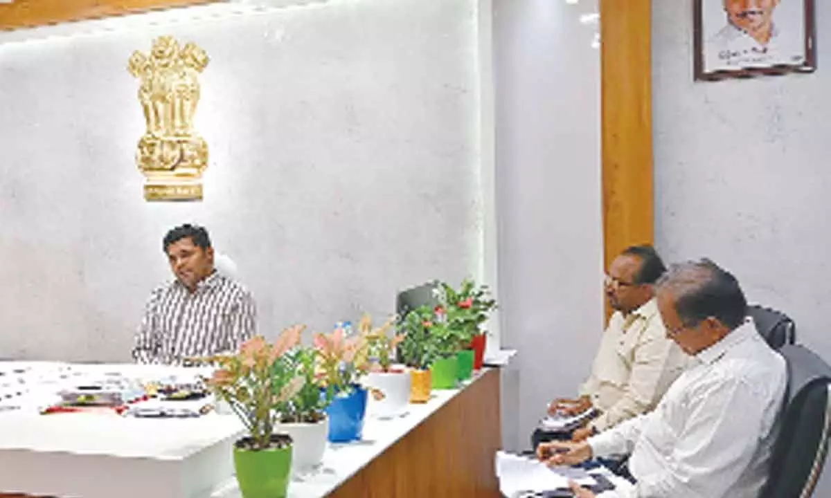 Joint Collector Ch Sridhar speaking at a review meeting on the Kharif grain purchase process in Rajahmundry on Friday