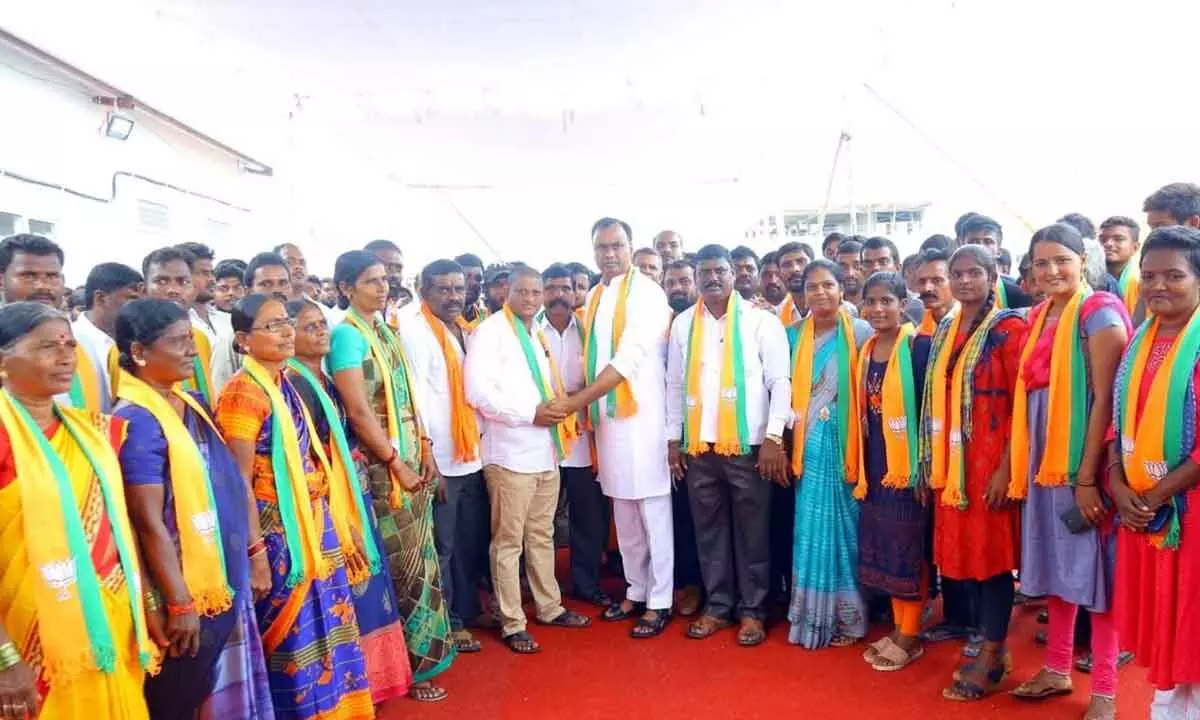 Former MLA Rajgopal Reddy welcoming other parties leaders and workers into the BJP fold  in Munugodu on Friday
