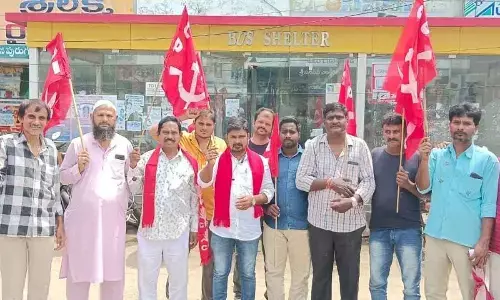CPI leaders staging a protest at AC bus shelter near Gandhi Statue Centre in  Nellore on Friday