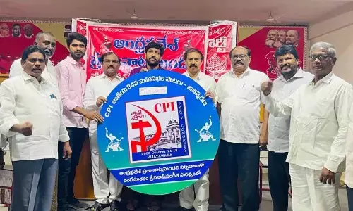 CPI State secretary K Rama Krishna, State assistant secretary Muppalla Nageswara Rao and district secretary J Ajay Kumar releasing a songs CD at Mallaiah Lingam Bhavan in Guntur city on Sunday
