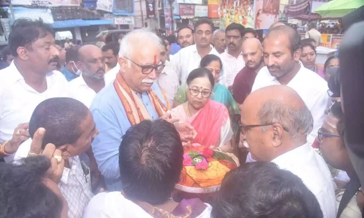 Hereditary chairperson of Pydithalli temple P Ashok Gajapathi Raju offering silk clothes to the deity at the temple in Vizianagaram on Monday