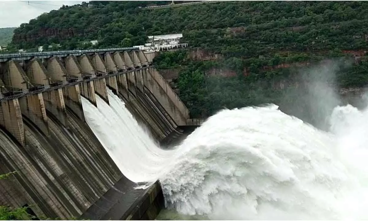 The authorities of Srisailam Dam releasing water downstream by lifting 3 radial crest gates on Monday