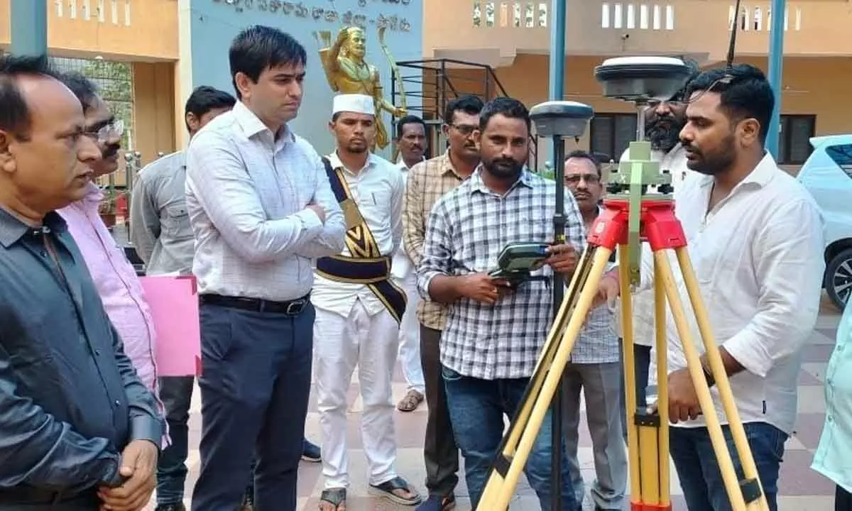 Collector Sumeet Kumar inspecting DGPS equipment in Paderu on Monday