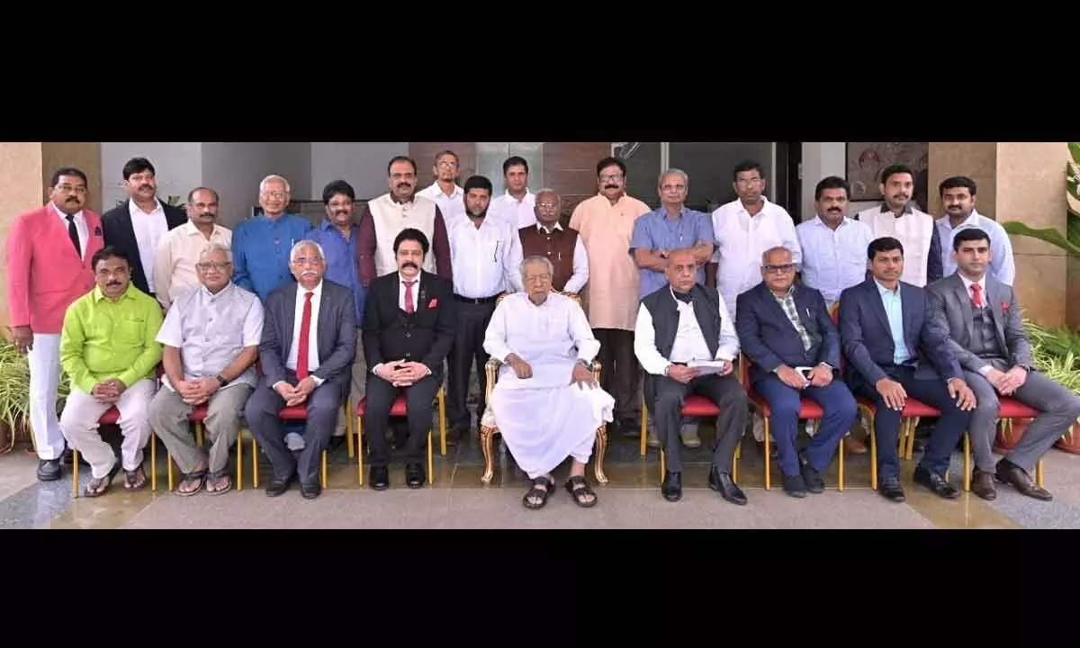The newly elected managing committee of Indian Red Cross Society (AP Branch) with Governor Biswabhusan Harichandan at Raj Bhavan in Vijayawada on Monday