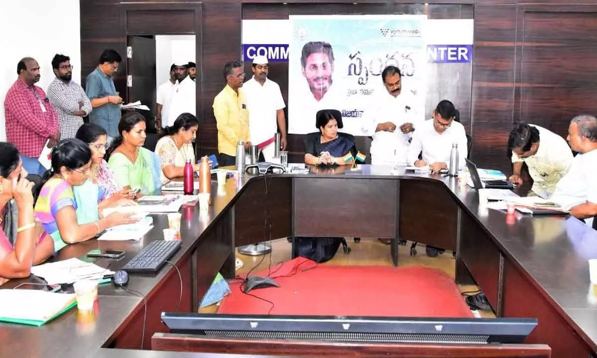 VMC Commissioner Swapnil Dinkar Pundkar going through the petitions along with Mayor  R Bhagya Lakshmi at  VMC in Vijayawada  on Monday