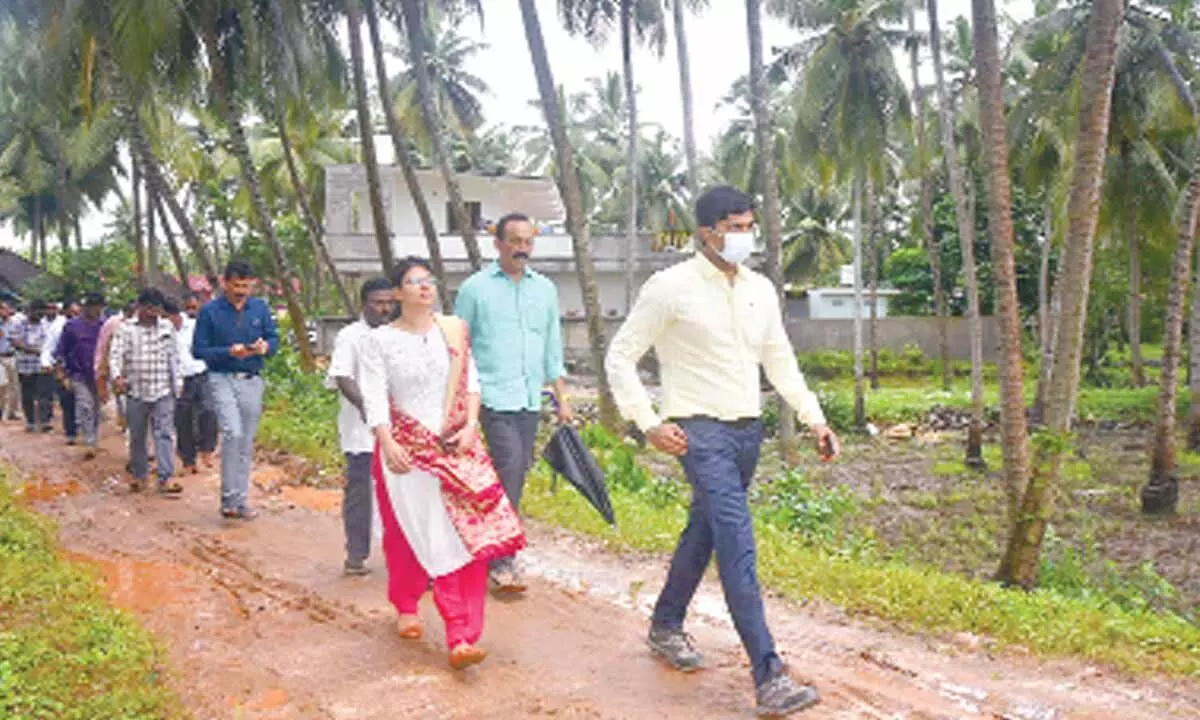 NDMA Junior Consultant Javed, Medical Officer Avaneeth and Joint Collector HM Dhyan Chand inspecting the flood-hit areas in P Gannavaram mandal on Tuesday