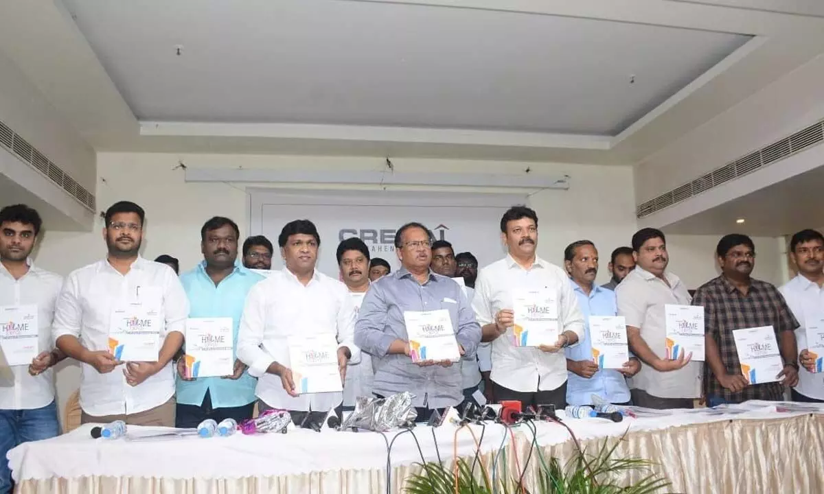 CREDAI Rajahmundry Chapter members unveiling brochures of Home Expo at a press conference in Rajamahendravaram on Tuesday