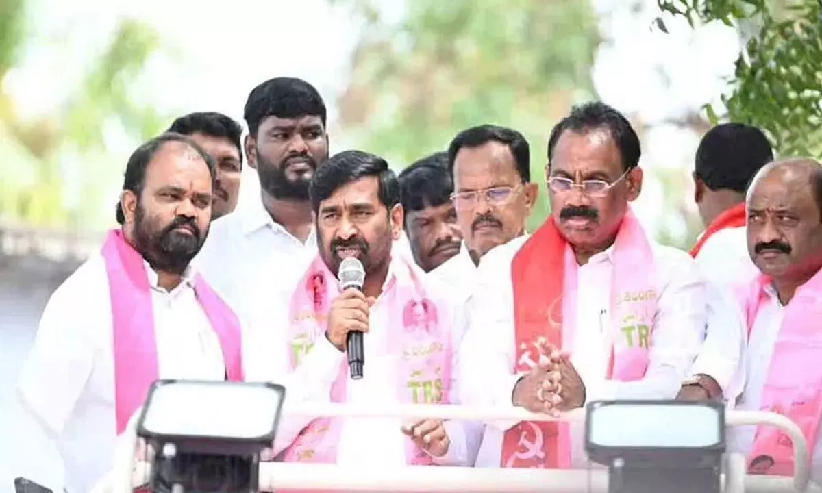 Minister Jagadsih Reddy along with party candidate for Kusukuntla Prabhakar Reddy during poll campaign in Velmakanne village on Wednesday