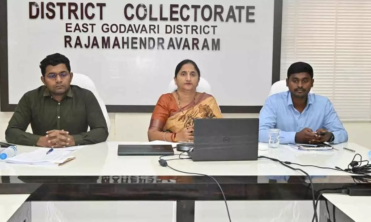 District Collector K Madhavi Latha, Joint Collector Ch Sridhar and Municipal Commissioner K Dinesh Kumar participating in a videoconference from the Collectorate in Rajamahendravaram on Thursday