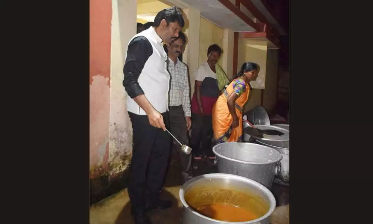Andhra Pradesh Food Commission Chairman Ch Pratap Reddy inspecting the cooking area in a hostel at Paderu on Thursday