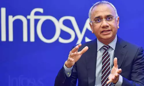 Infosys Q2 net up 11% at `6,021 cr