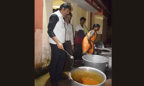 Andhra Pradesh Food Commission Chairman Ch Pratap Reddy inspecting the cooking area in a hostel at Paderu on Thursday