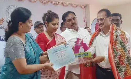 Minister for Panchayat Raj and Rural Development Errabelli Dayakar Rao, Secretary to CM Smita Sabharwal and CMO OSD Priyanka Varghese felicitating an official of the Mission Bhagiratha in Hanumakonda on Friday