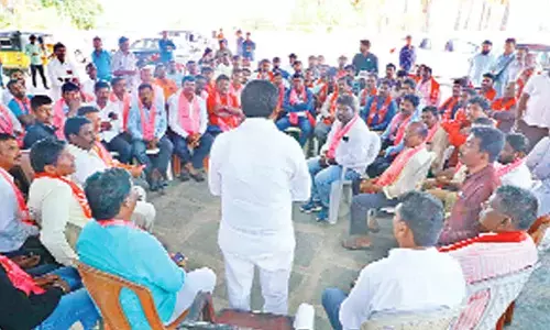 Energy Minister G Jagdish Reddy having a huddle over byelection strategies with community leaders in Munugodu on Saturday