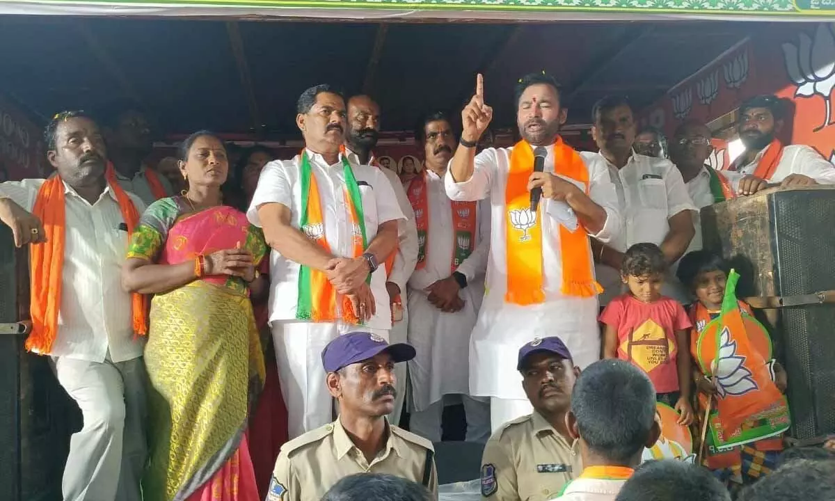 Union Minister Kishan Reddy addresing the villagers of Kistapuram in Munugodu mandal