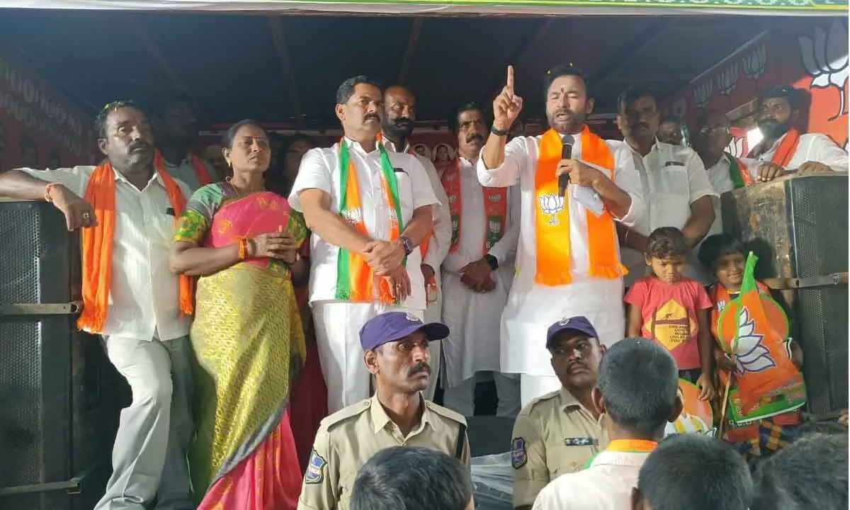 Union Minister Kishan Reddy addresing the villagers of Kistapuram in Munugodu mandal