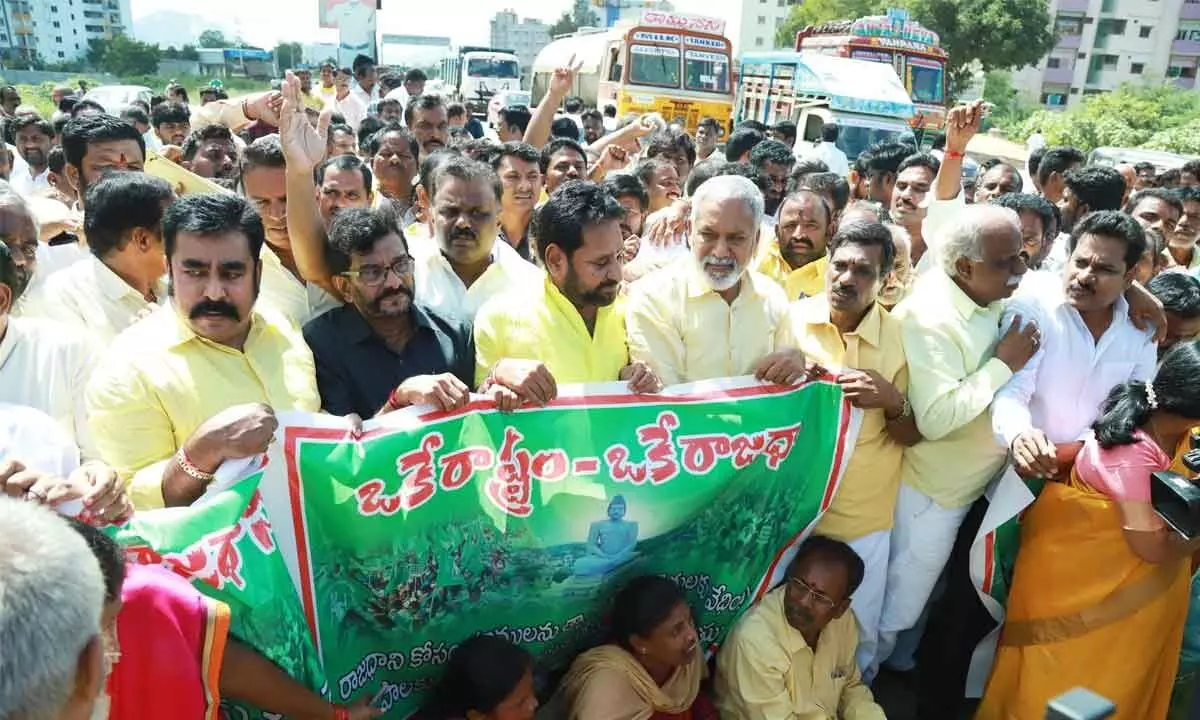 Former Ministers N Amaranatha Reddy, Somireddy Chandramohan Reddy and others staging a rasta roko protesting against the three capitals in Tirupati on Monday