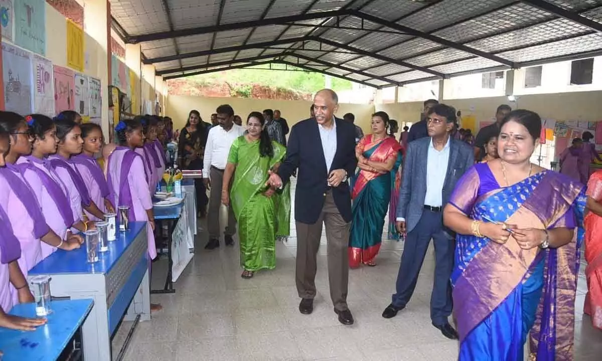 Ambassadors P Harish and B Bala Bhaskar along with the district officials visiting a school in Visakhapatnam on Monday