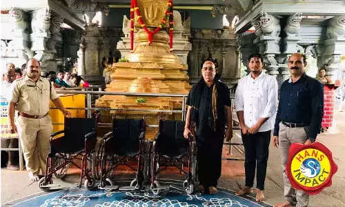 The Women & Child welfare and Disabled department officials handing over  three chairs to Rama temple authorities  in Bhadrachalam on Monday