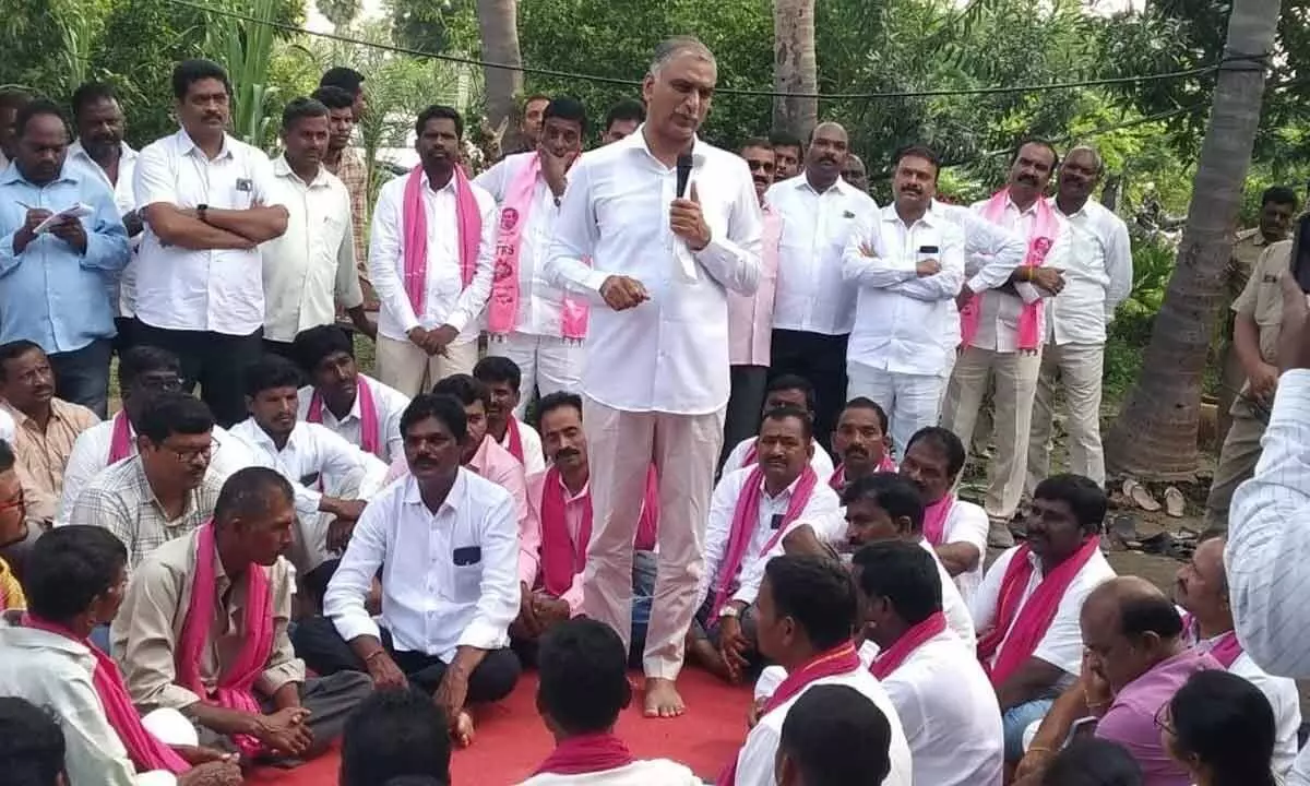 Health Minister Harish Rao addressing  a gathering during his campaign in Rajupet thanda in Marriguda mandal on Wednesday