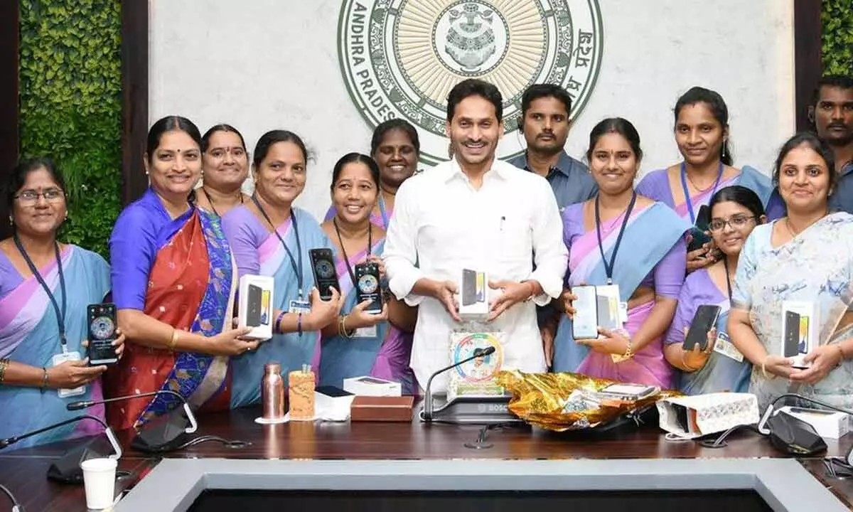 Chief Minister Y S Jagan Mohan Reddy launches distribution of mobile phones to Anganwadi staff and supervisors, at his camp office in Tadepalli on Wednesday