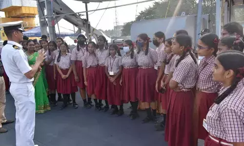 Students being briefed about the importance of maritime security as a part of Navy Day celebrations in Visakhapatnam
