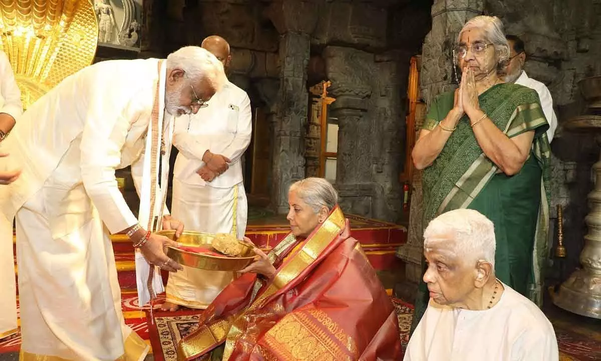 TTD chairman Y V Subba Reddy offering prasadam to Union finance minister Nirmala Sitharaman after she had darshan of Lord Venkateswara in Tirumala temple on Thursday
