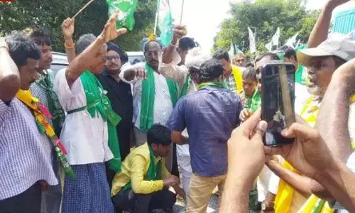 Villagers washing the feet of Amaravati farmers with milk in Anaparthi constituency on Thursday