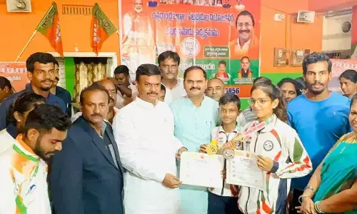 BJP MLC P V N Madhav presenting appreciation certificates to the athletes in Visakhapatnam on Thursday