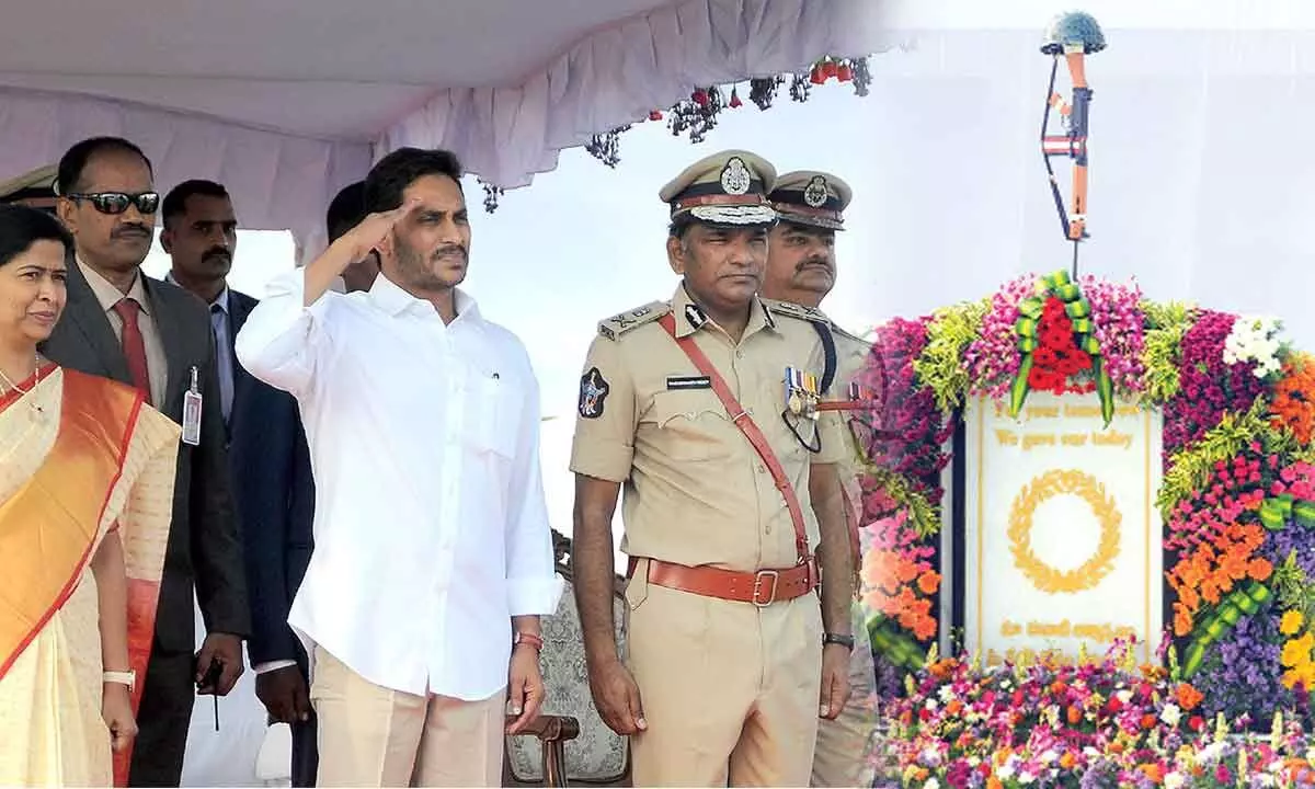 Chief Minister Y S Jagan Mohan Reddy paying floral tributes police martyrs on the occasion of Police Commemoration  Day along with home minister Thaneti Vanitha and DGP Kasireddy Venkata Rajendranath Reddy at IGMC stadium in Vijayawada on Friday 						                  Hans photo: Ch Venkata Mastan