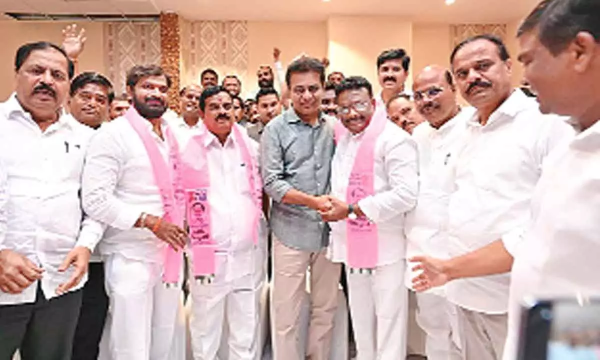 BJP leaders Dasoju Sravan and K Swamy Goud joining TRS in the presence of party working president KT Rama Rao at Manneguda on Friday