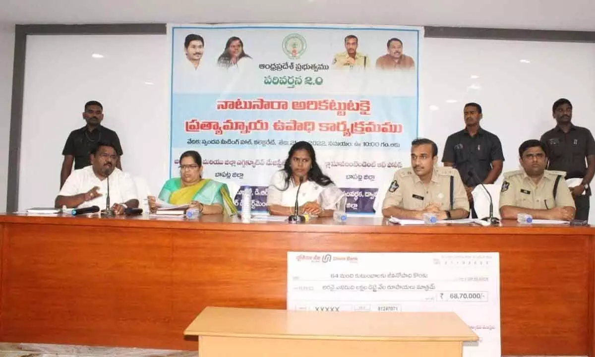District Collector Vijaya Krishnan speaking at a meeting at the Collectorate in Bapatla on Friday. SP Vakul Jindal is also seen