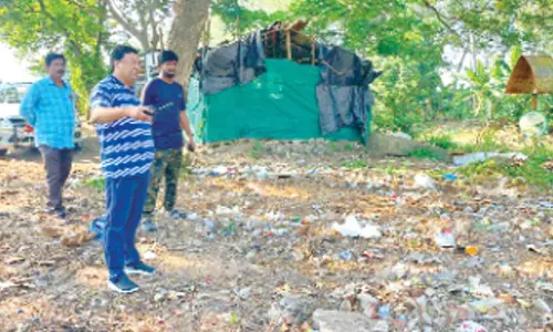 KMC Additional Commissioner Ch Naga Narasimha Rao and Municipal Health Officer Dr Prudhvi Charan inspecting the areas in 12th circle in Kakinada on Tuesday