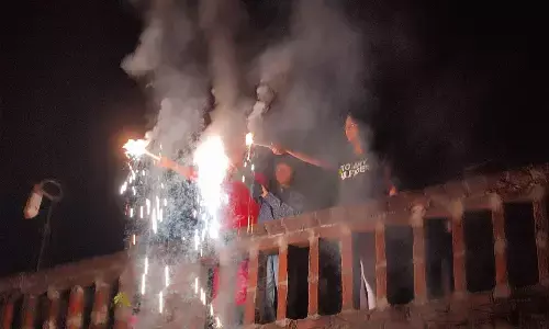 People celebrating Diwali by bursting crackers in Visakhapatnam