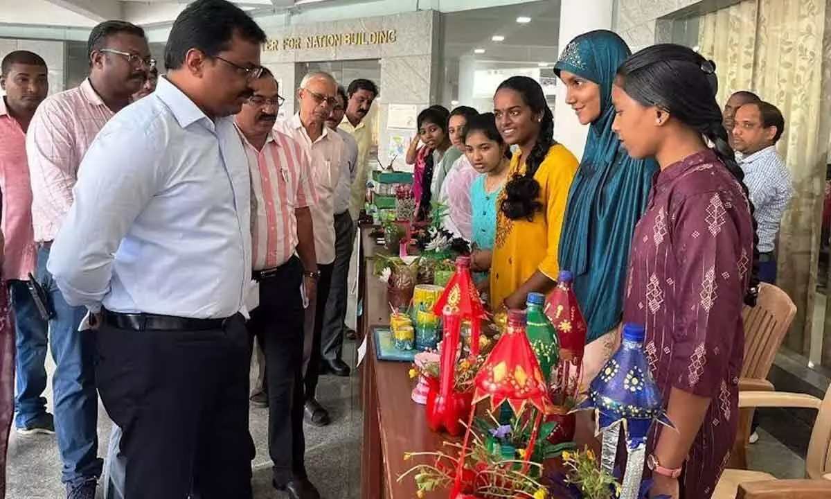 Municipal Commissioner P Raja Babu observing the exhibits of the students at VIIT in Visakhapatnam on Wednesday