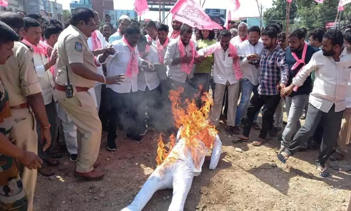 MLAs poaching row: TRS activists stage sit-in Adilabad