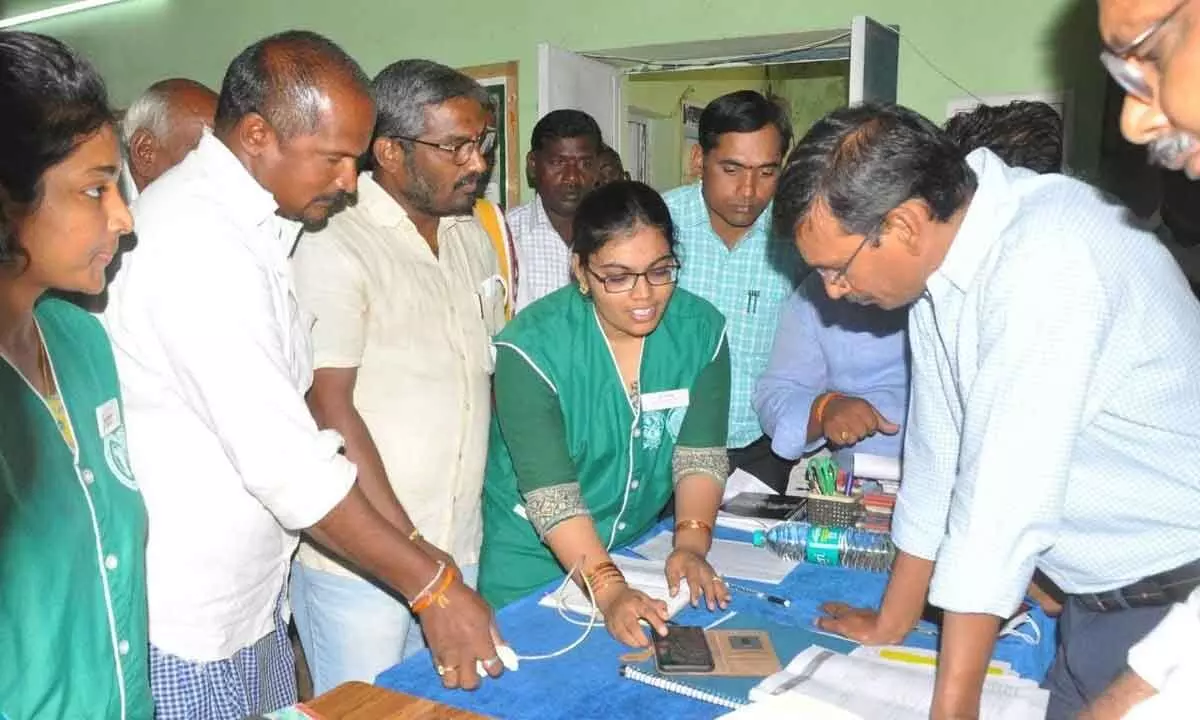 District Collector P Koteshwara Rao inspecting the registration of e-Crop process at RBK in Gargeyapuram village on Friday