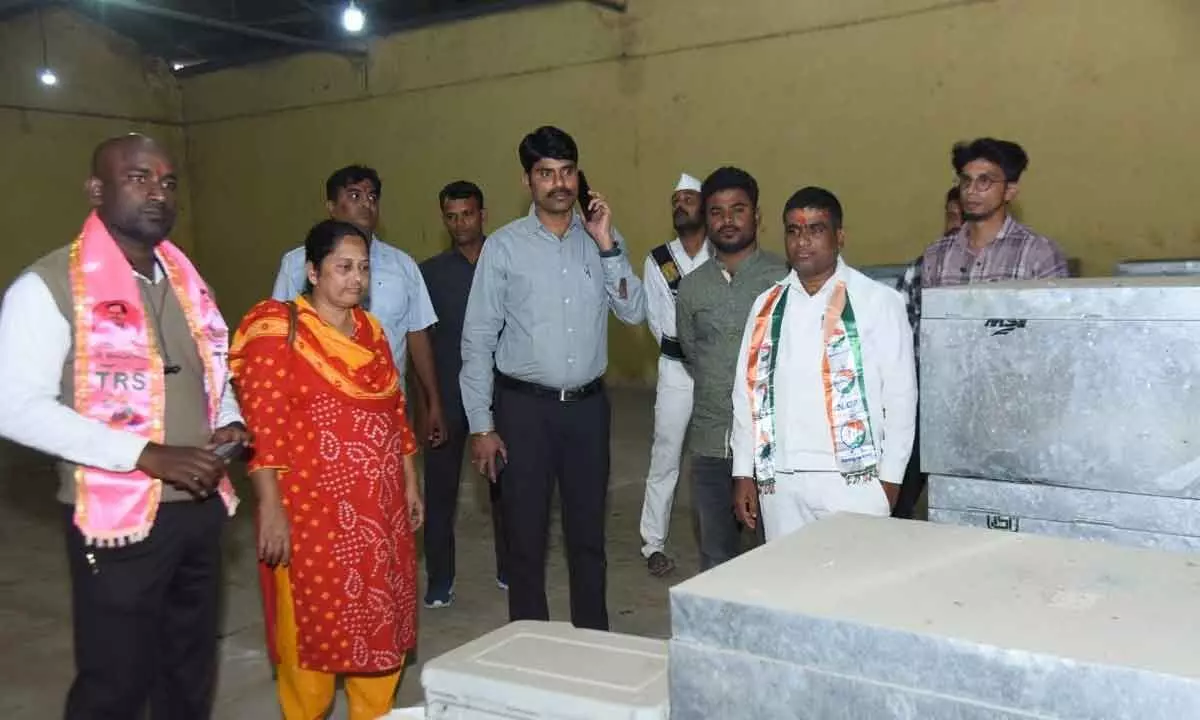 Collector and political parties representing inspecting the checking EVM strongroom in Nizamabad on Friday