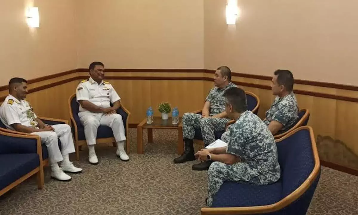 Indian Navy personnel interacting with Singapore Navy personnel